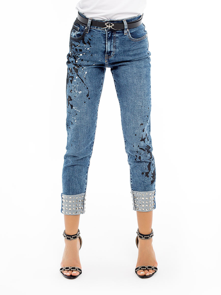 Jeans with eyelets and art elements
