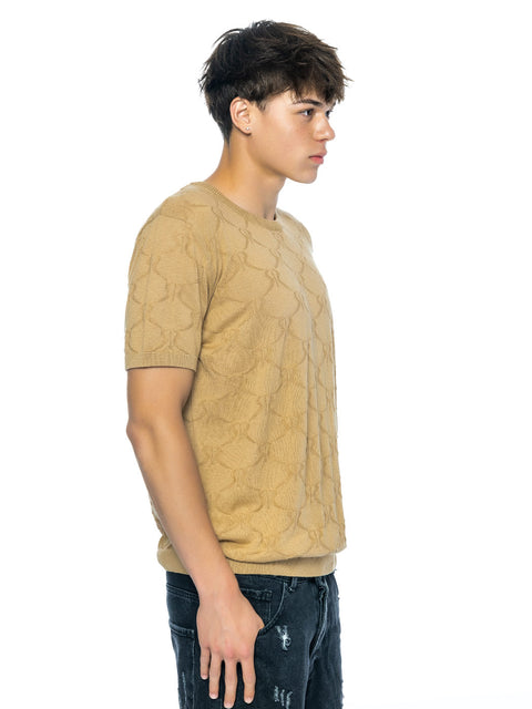 Knitted beige blouse with all-over print of small logos and merino wool