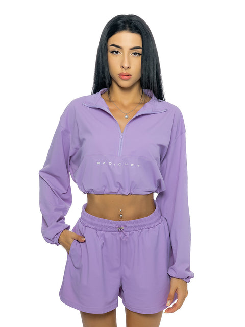 Short sports top in purple with inscription and logo