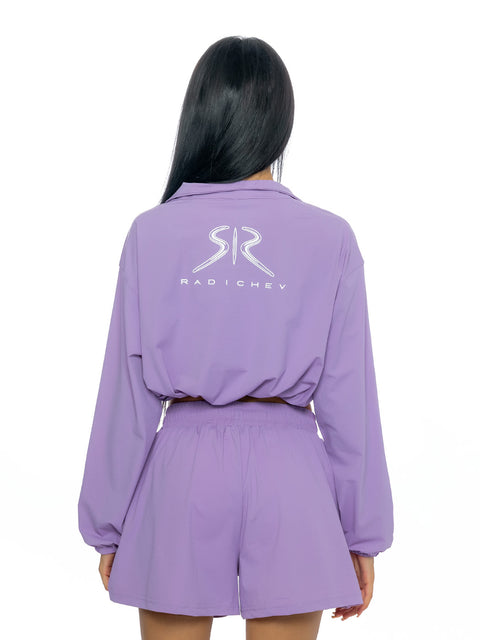 Short sports top in purple with inscription and logo