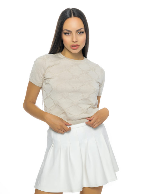 Short beige knitted blouse with all-over logos