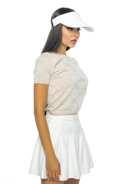 Short beige knitted blouse with all-over logos